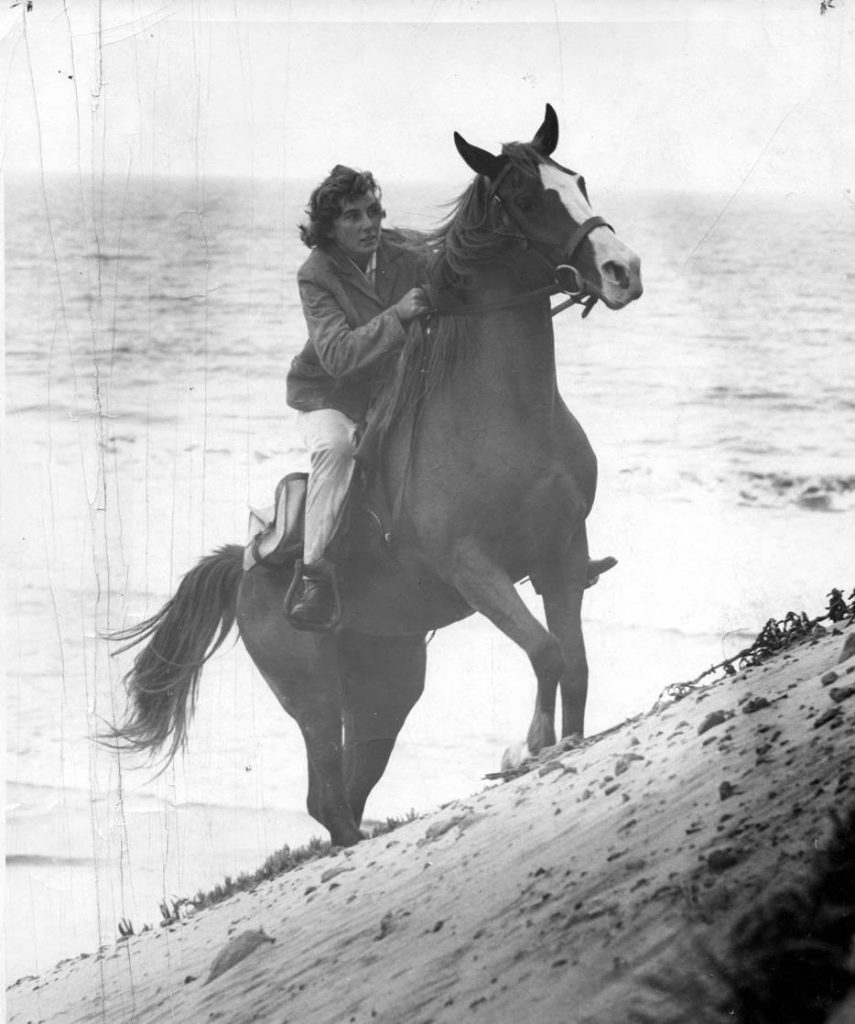 Linda Tellington-Jones riding arabian horse on beach